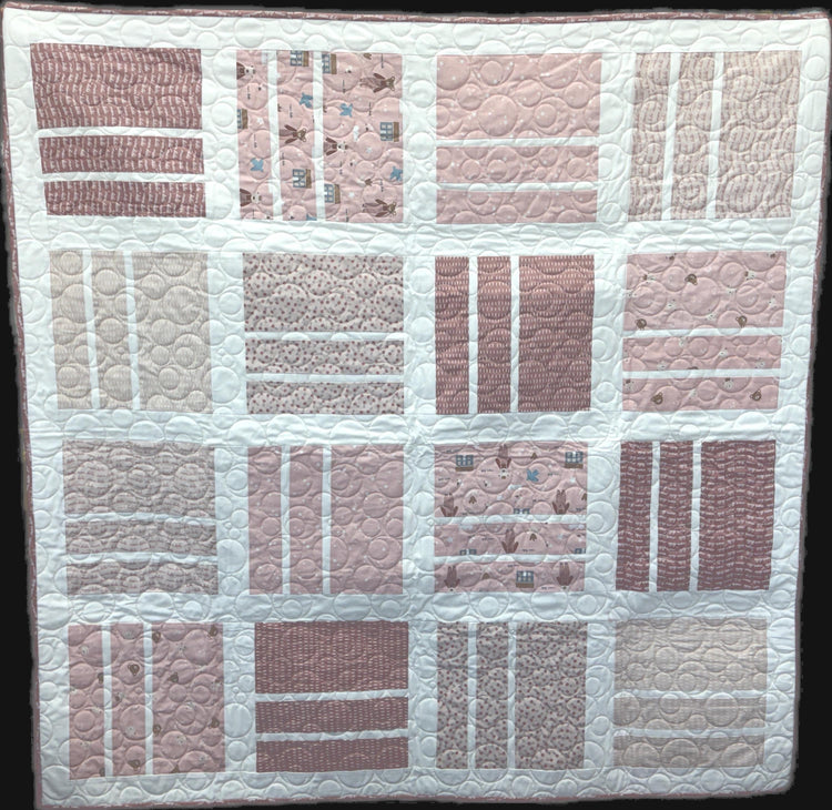 Squared Up Baby Girl Quilt Kit with Cozy Bebe Fabric by Riley Blake Designs with printed Squared Up Pattern by Fran Gulick of Cotton & Joy