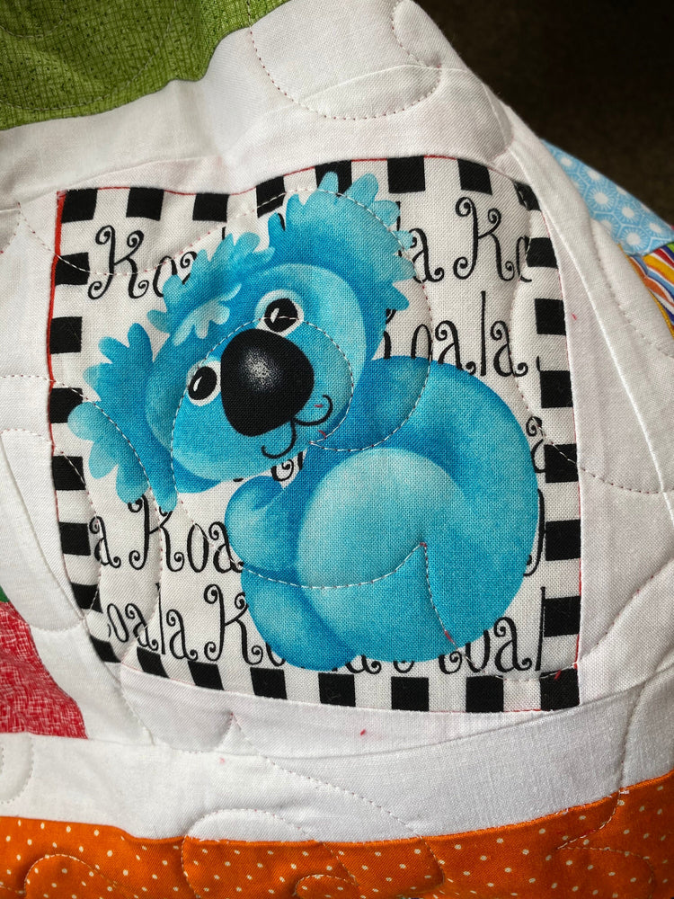 Wonky Strip Quilt for a boy or girl with a plush red minky back