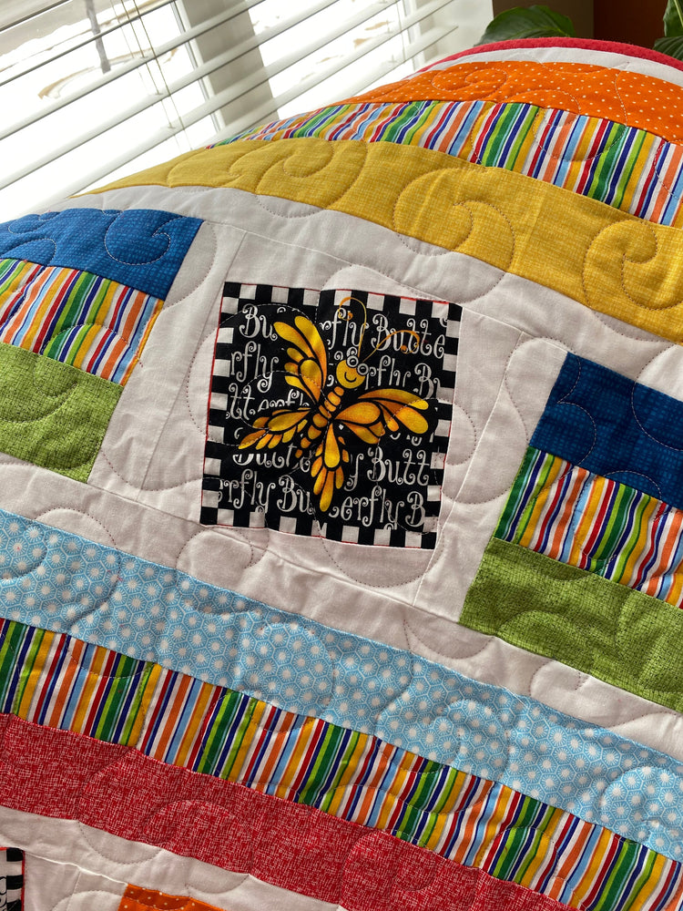 Wonky Strip Quilt for a boy or girl with a plush red minky back